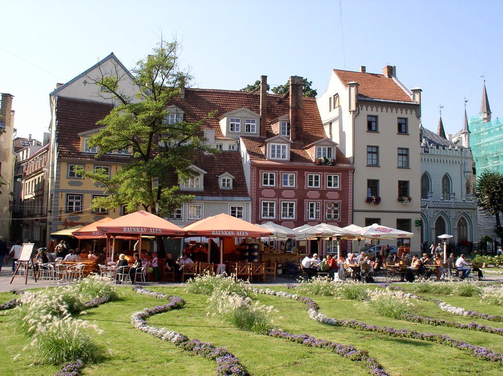 Tourists enjoying the local flavors of Riga, Latvia.
