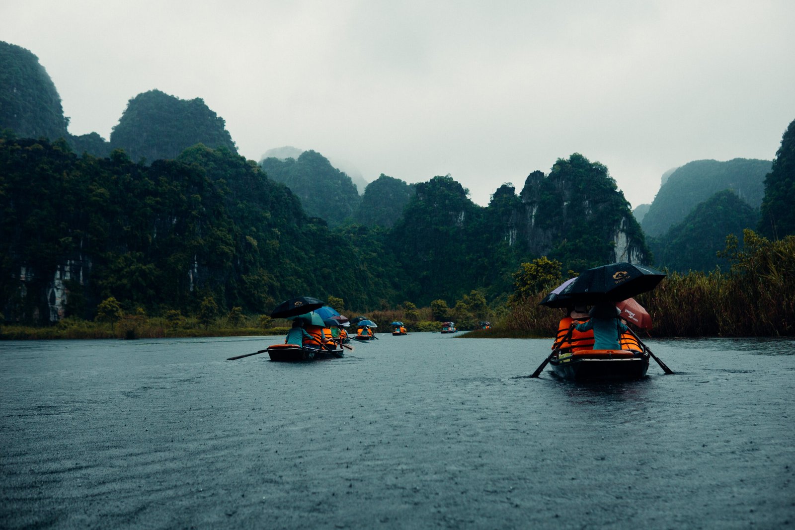 An image of tourists on boats in Ninh Binh, Vietnam