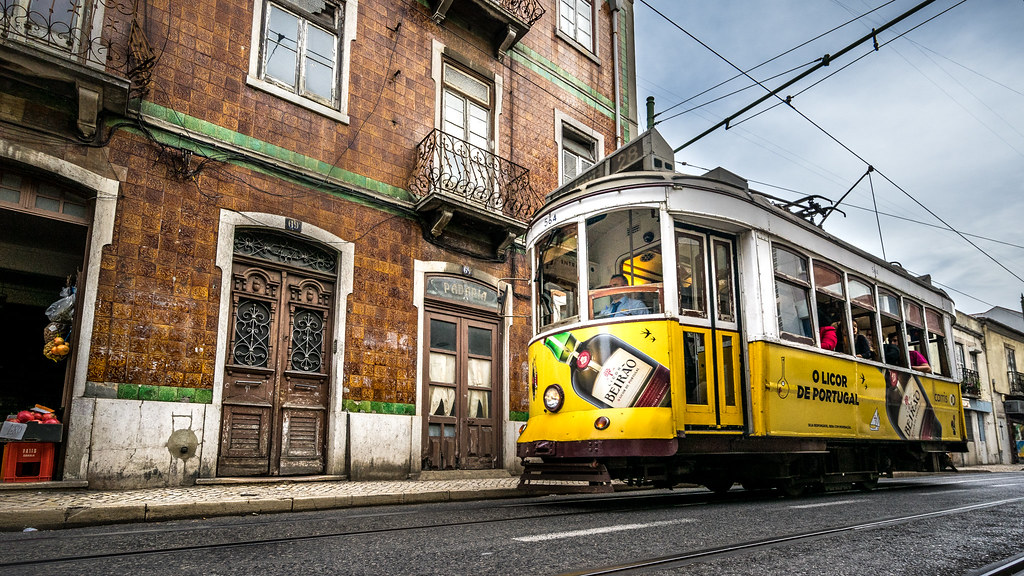 An image of a yellow tram in the Tram 28 line. 