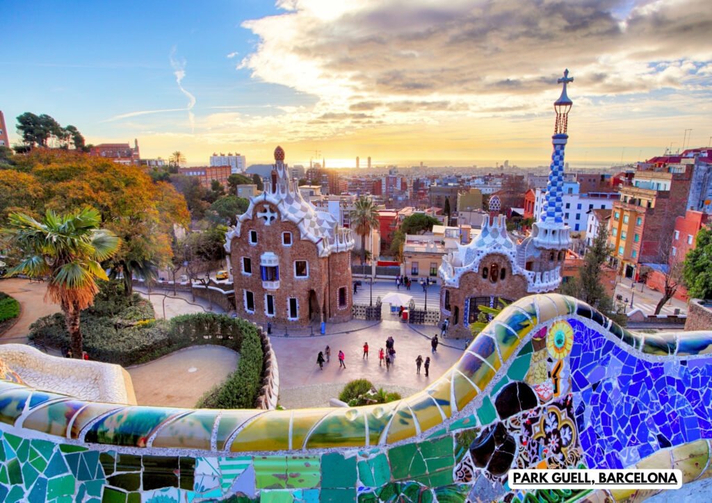 Park Güell in Barcelona featuring Gaudí's colorful mosaic architecture, whimsical buildings, and panoramic city views at sunset