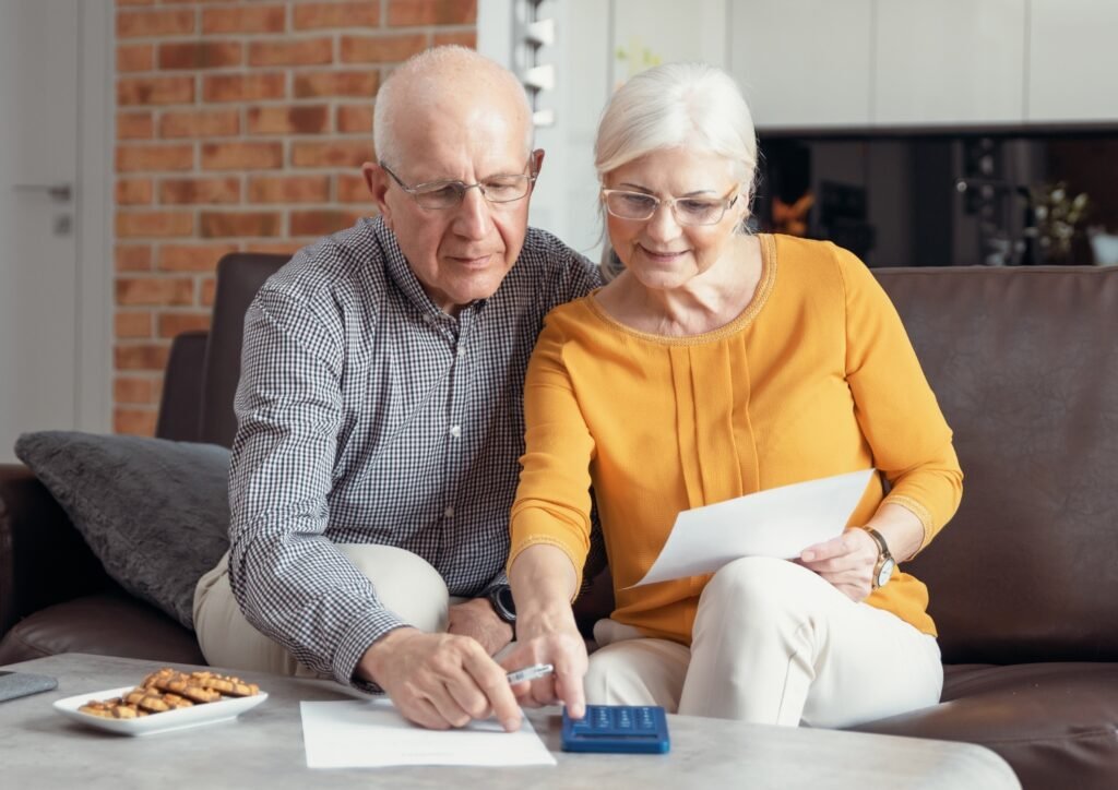 senior couple budgeting for a Bali health retreat.