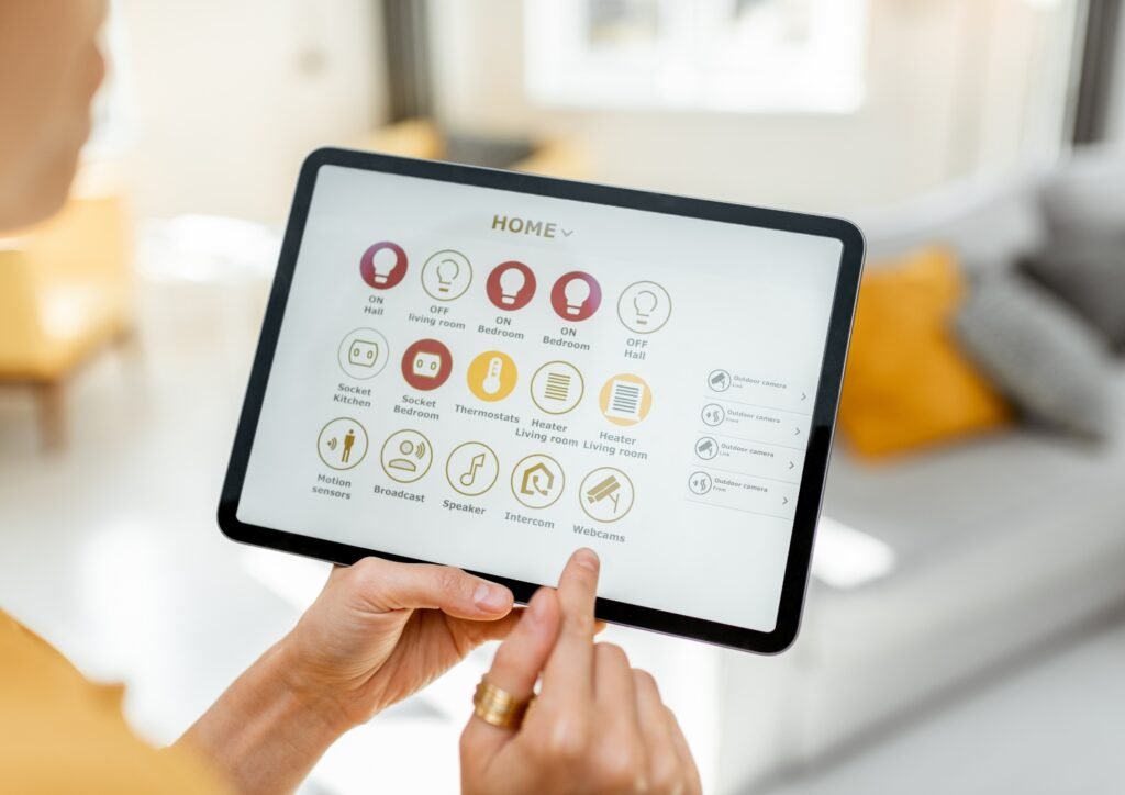 a person holding a tablet opening a home automation  management apps