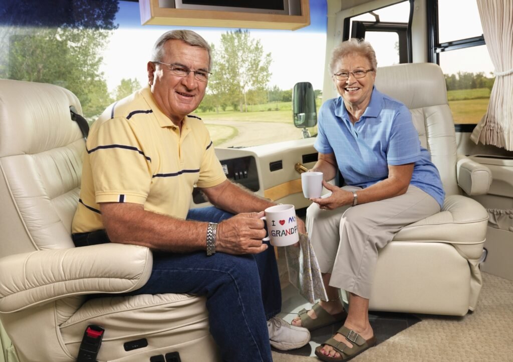 An image of a senior couple enjoying coffee in an RV.
