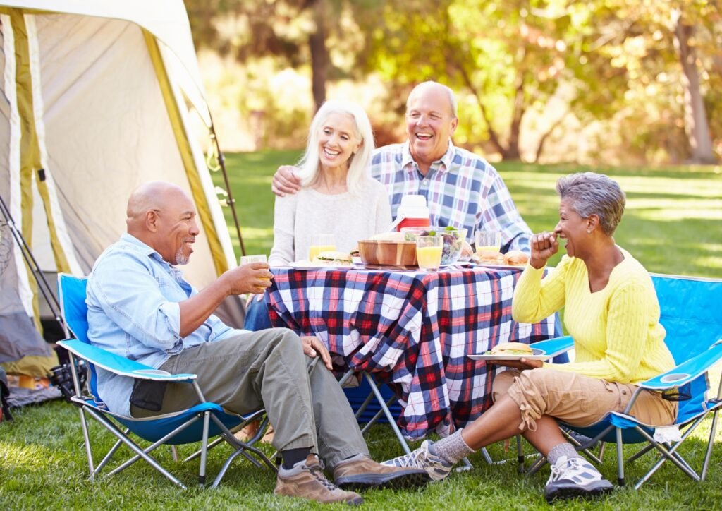 a group of seniors enjoying camping