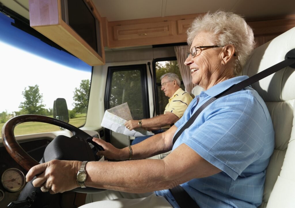 A senior couple enjoying RV ride.