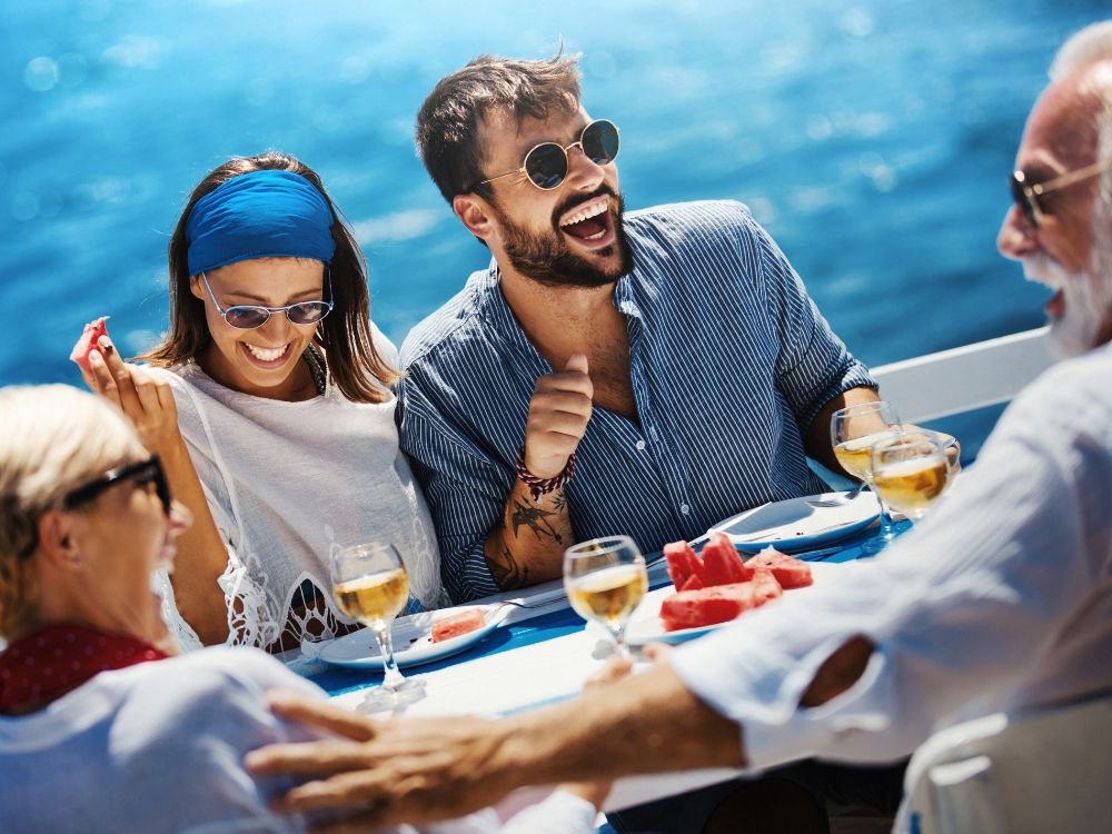An image of two couples dining together during a cruise trip. 