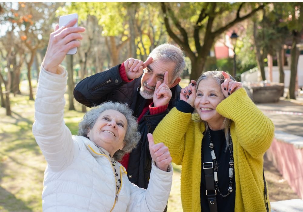 An image of retirees taking a selfie. 