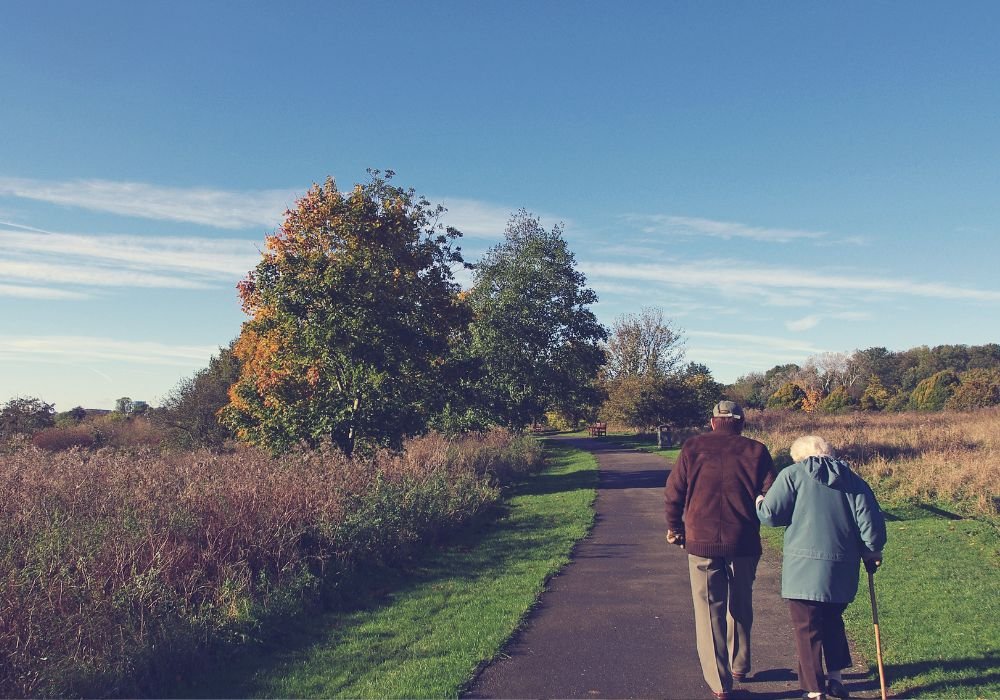 An image of a senior couple taking a walk. 