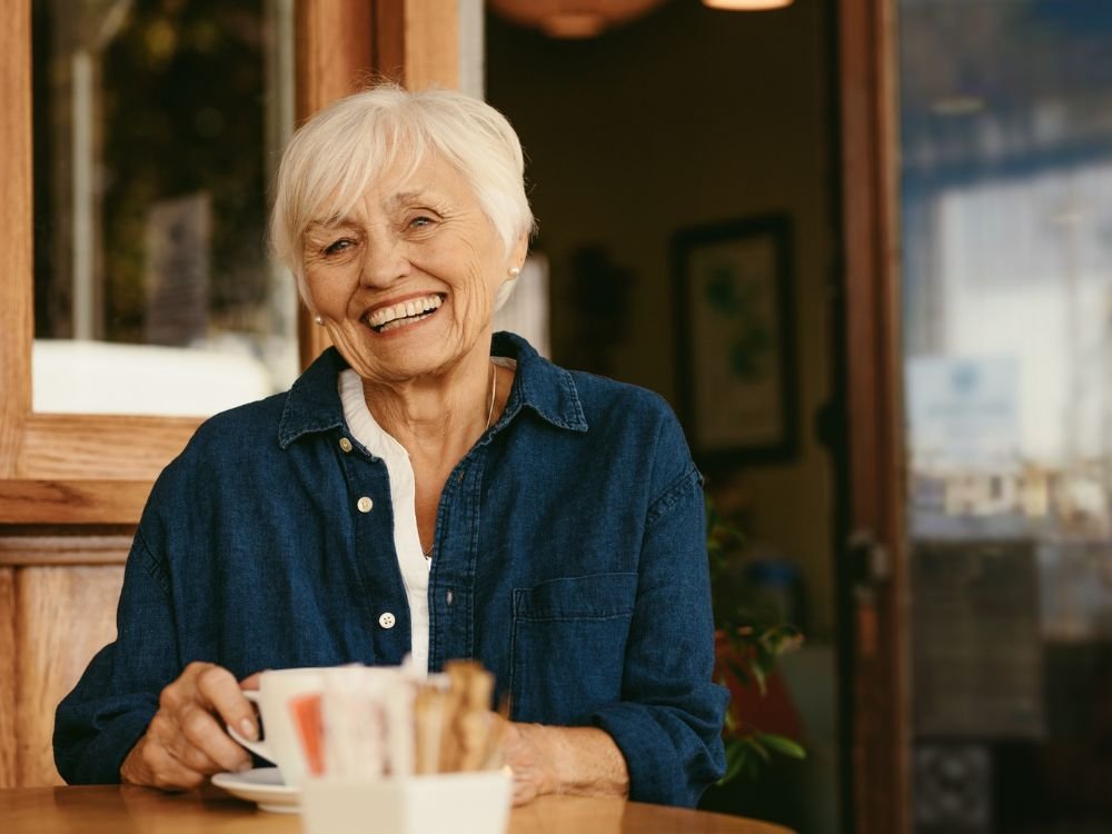 An image of a female senior enjoying coffee. 